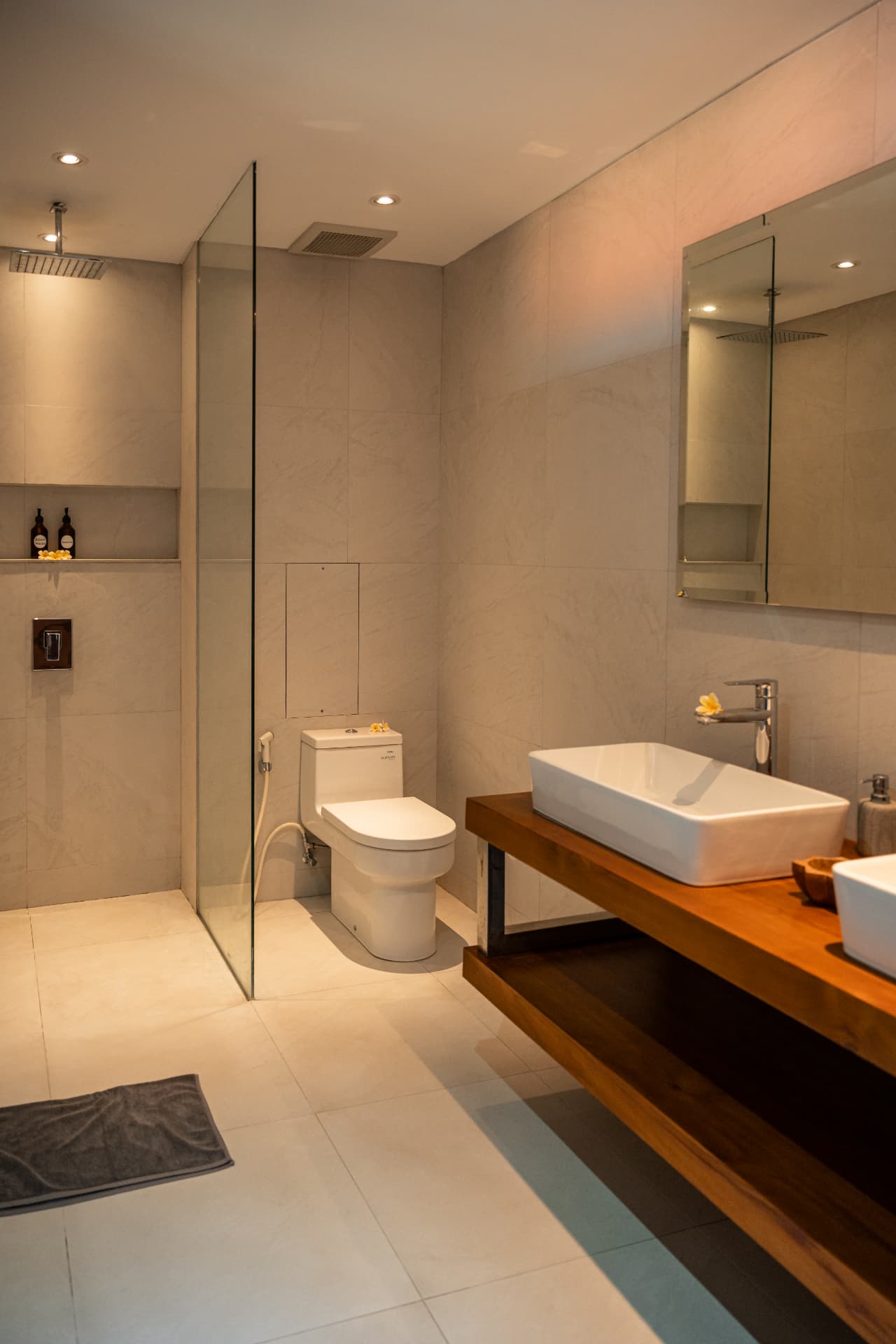 Elegant villa bathroom with glass shower and double vanity for Bali property listing
