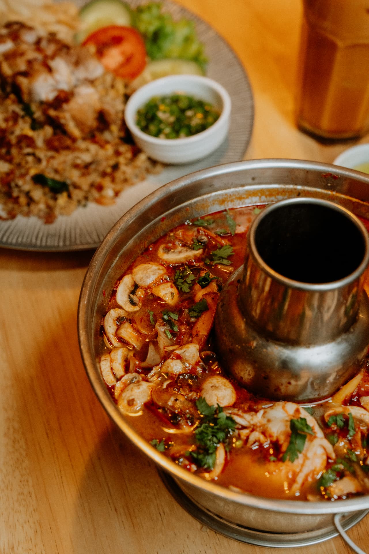 Tom yum hot pot with seafood and fried rice photographed for a Bali restaurant