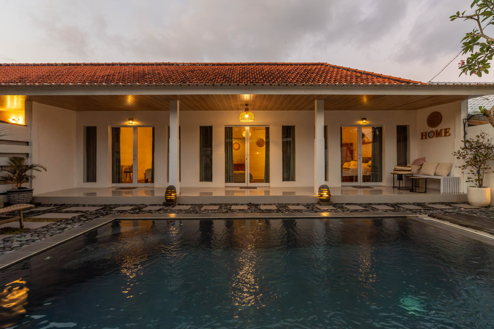 Bali villa exterior and pool photographed at blue hour for an Airbnb listing
